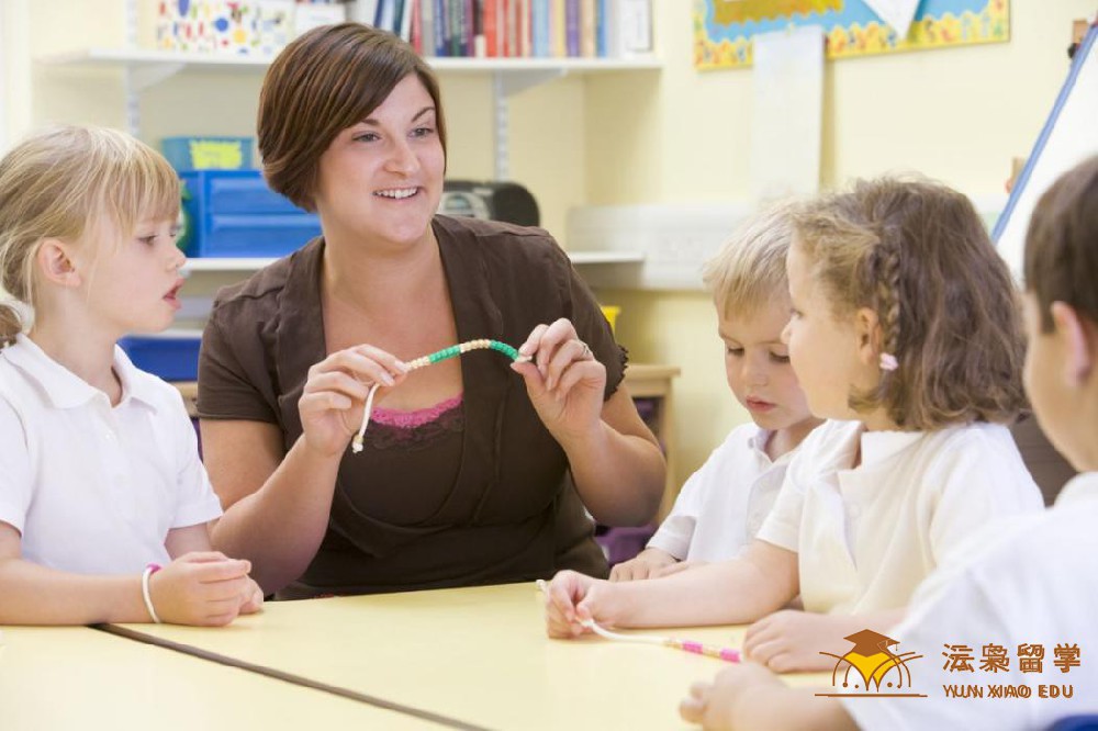 Teacher with young students learning mathematics with beads